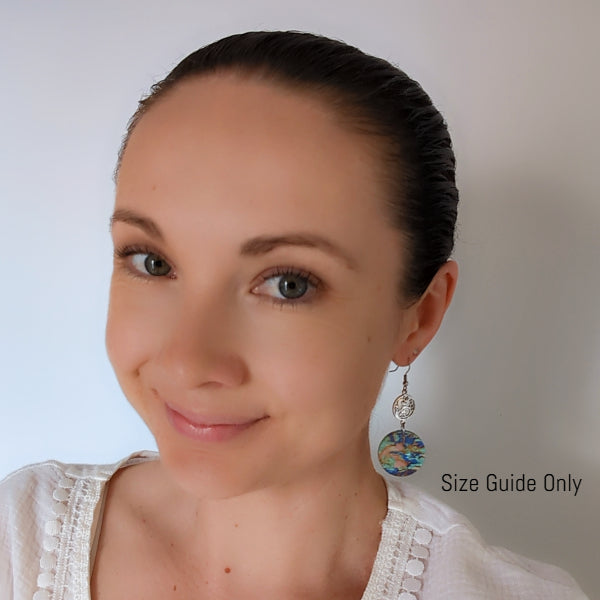 Woman wearing Aria Dangles as a size guide.