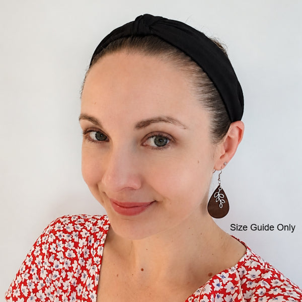Woman wearing Asha Drops as a size guide.