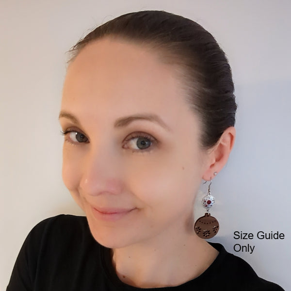 Woman wearing Belle Dangles as a size guide.