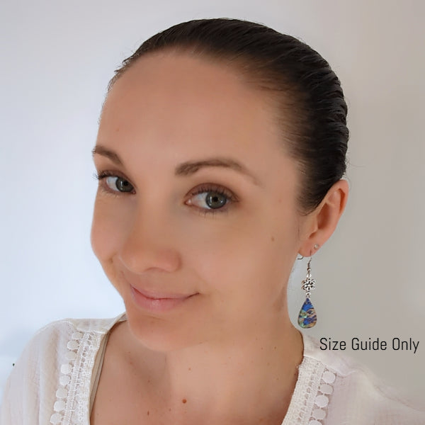 Women wearing Cleo Dangles as a size guide.