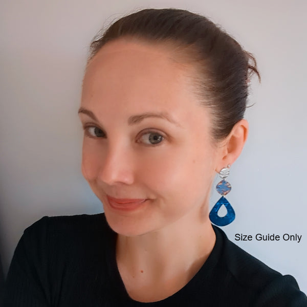 Woman wearing Gloria Studs as a size guide