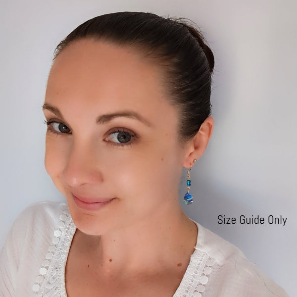 Woman wearing Pixie Dangles as a size guide.