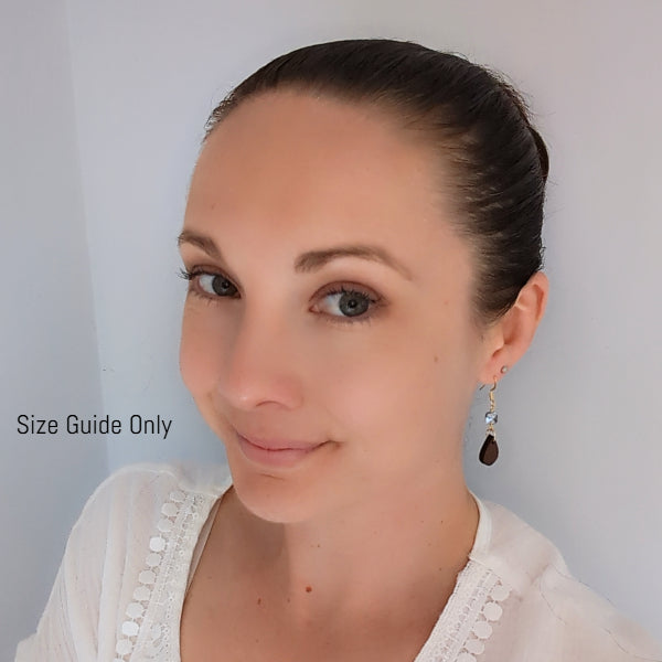 Woman wearing Pixie Dangles as a size guide.