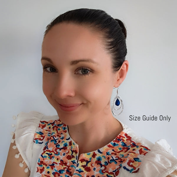 Woman wearing Seraphina Dangles as a size guide.