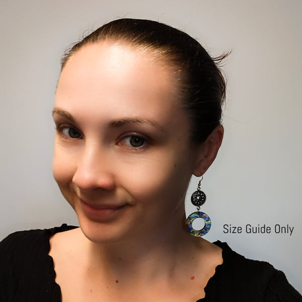 Woman wearing Starburst Dangles as a size guide.