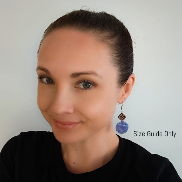 Woman wearing Zia Dangles as a size guide.