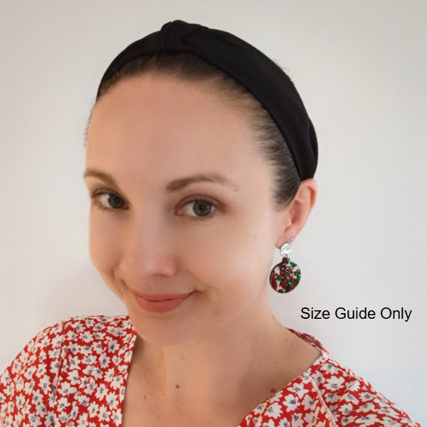 Woman wearing Joy Studs as a size guide.