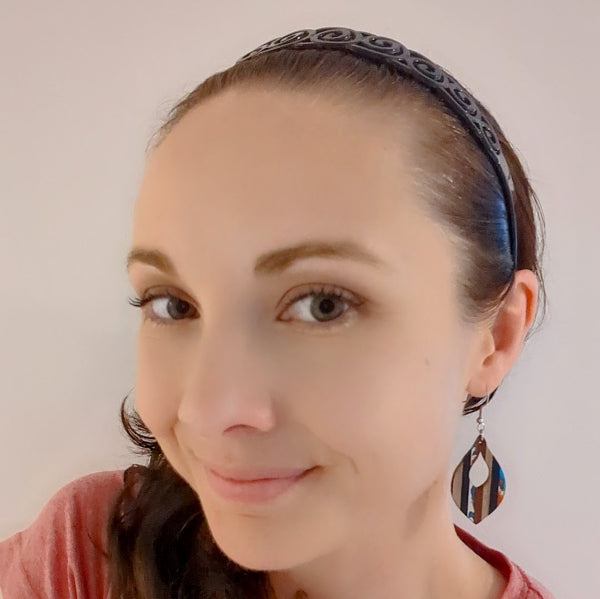 Women wearing striped drops as a size guide.