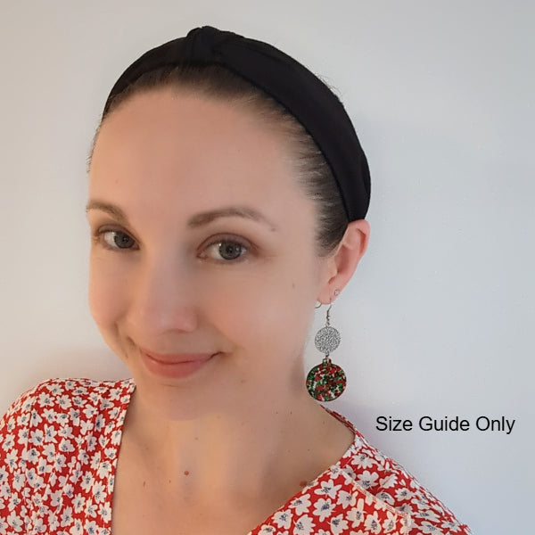 Woman wearing Bauble Dangles as a size guide.
