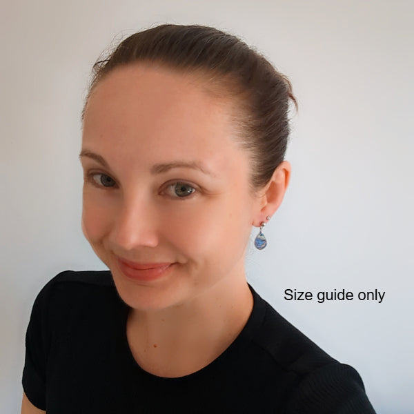 Woman wearing Pippa Studs as a size guide.