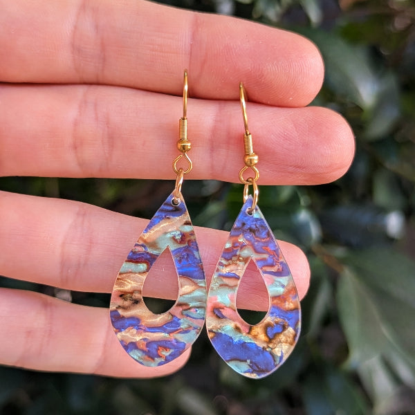 Colourful acrylic tear drop earrings with  gold toned hooks.