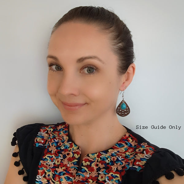Women wearing Bloom Drops as a size guide.