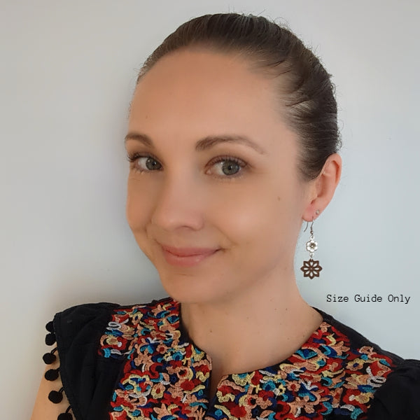 Women wearing Daisy Dangles as a size guide.