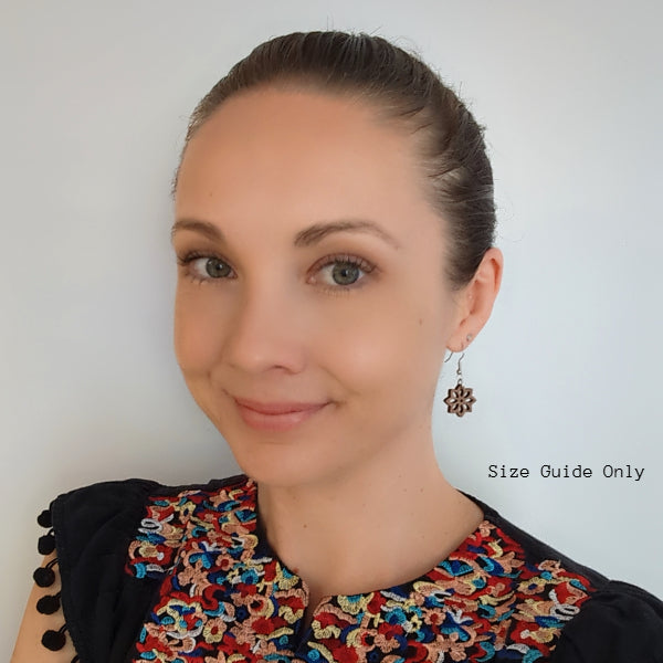 Women wearing Daisy Drops as a size guide.