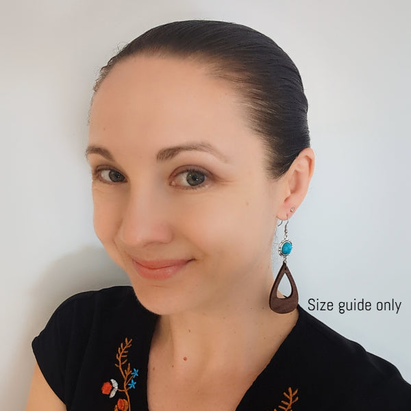 Women wearing Eliana Dangles as a size guide.