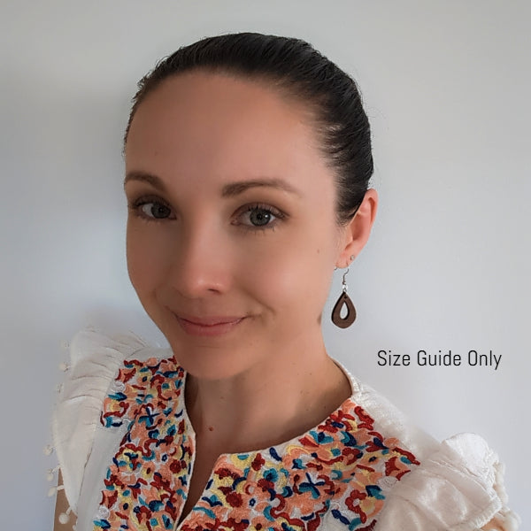 Woman wearing Elowen Drops as a size guide.