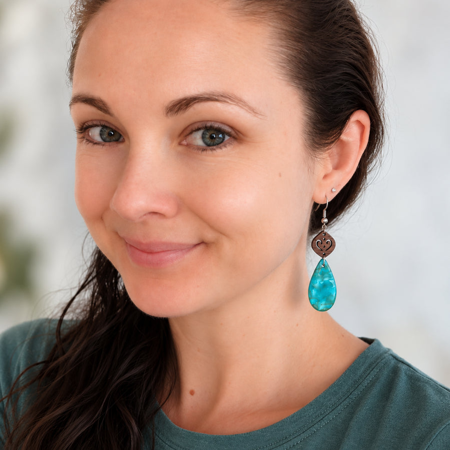 Woman wear gaia dangles as a size guide.