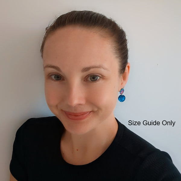 Woman wearing Gemma Studs as a size guide.