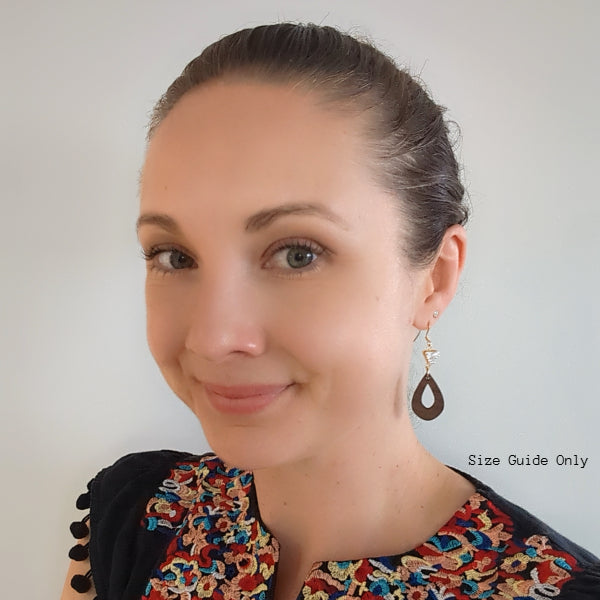 Women wearing Ember Dangles as a size guide.