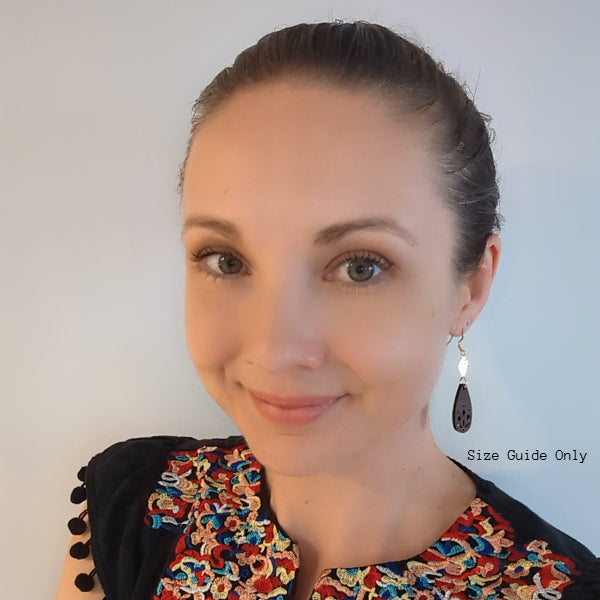 Women wearing Xanthe Dangles as a size guide.