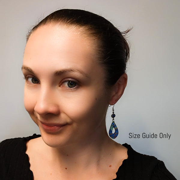 Woman wearing Indie Dangles as a size guide.