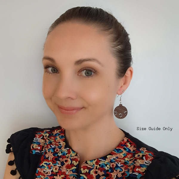 Woman wearing Joy Drops as a size guide.