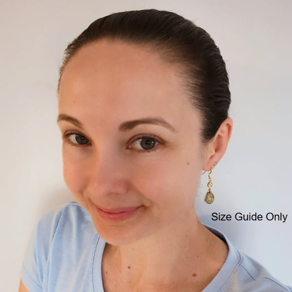 Woman wearing Kelsie Dangles as a size guide.