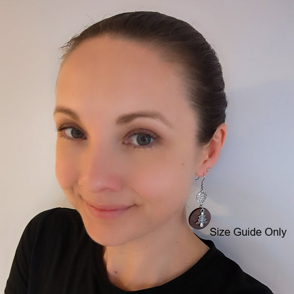 Woman wearing Noelle Dangles as a size guide. 