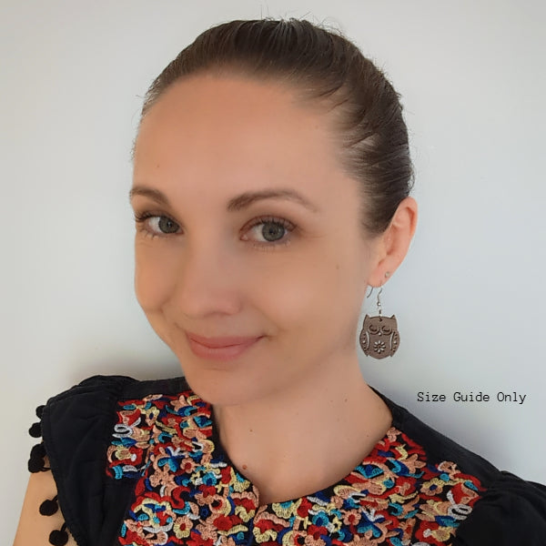 Women wearing Olive Owl Drops as a size guide.