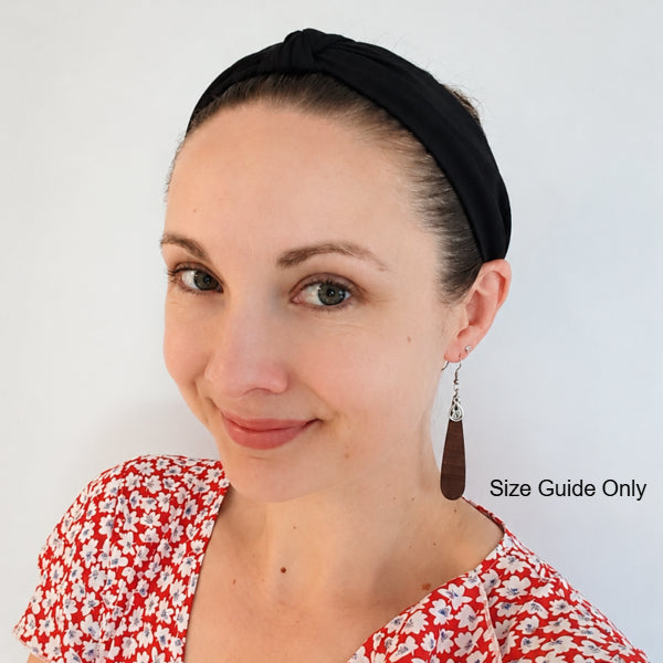 Woman wearing Ruby drops as a size guide.