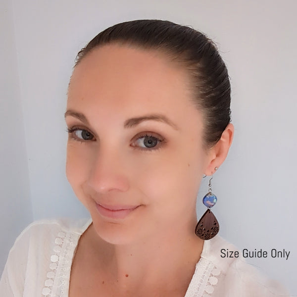 Woman wearing Siggy Dangles as a size guide.