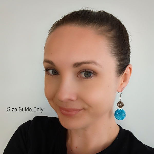 Woman wearing Skye dangles as a size guide.