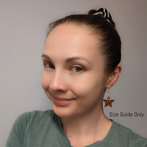Women wearing Star Drops as a size guide.