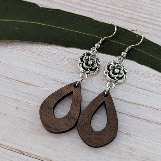 wooden tear drop earrings with silver toned flower connectors. Stainless steel hooks.