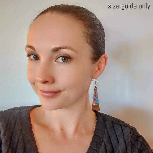 Women wearing Mystic drops as a size guide.