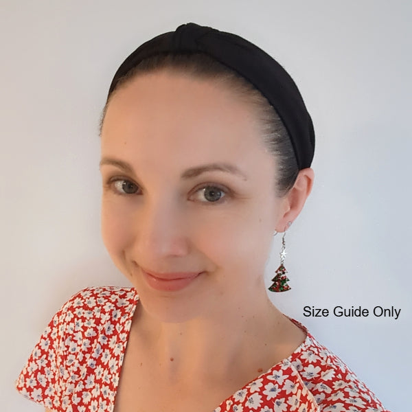 Woman wearing Neve Dangles as a size guide