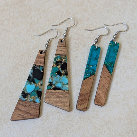 Two pairs of colourful earrings made from resin and wood on a beige background. Stainless steel hooks.