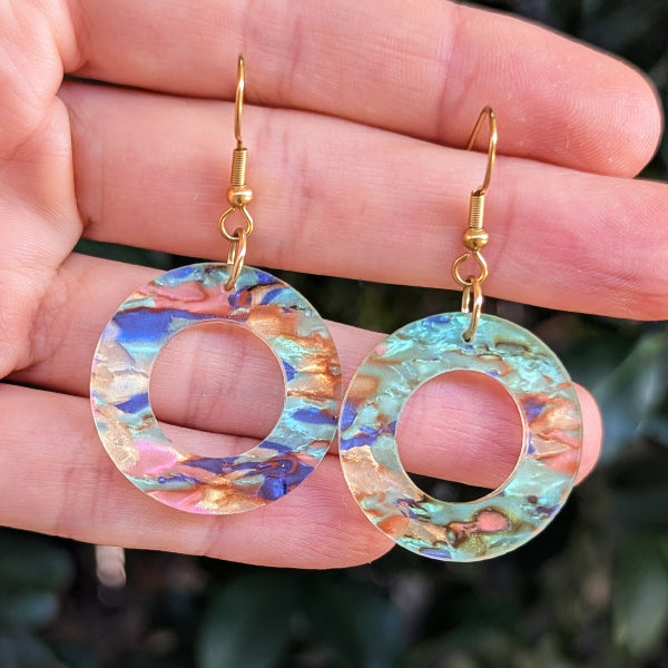 Colourful acrylic resin circular earrings.
