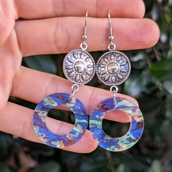 Colourful round acrylic earrings with sliver toned connectors.