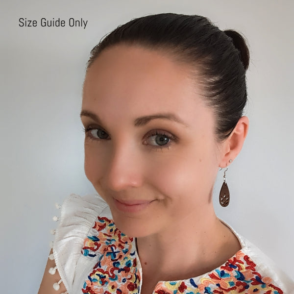 Woman wearing Wildflower Drops as a size guide.